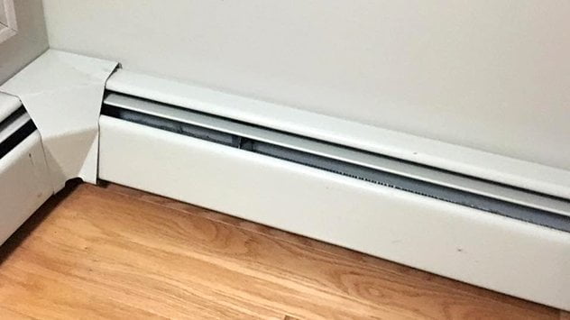 radiators like these are usually indicative of a boiler system that pumps hot water throughout the house, or electric heat which is less common in the northeast